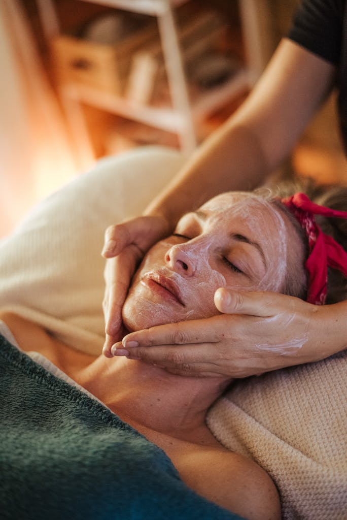 Female doing massage with mask on face